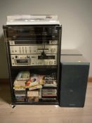 A glazed hi/fi cabinet containing a Technics turn table SL/B210, Technics hi/fi sperates,
