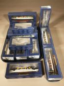 Fourteen Atlas Editions die cast scale model ships and ocean liners in boxes.