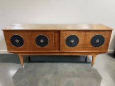 A 20th century Stonehill teak four door low sideboard, 182 cm x 45 cm x 78 cm.
