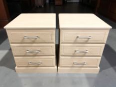 A pair of modern MDF three drawer bedside chests, width 52 cm.