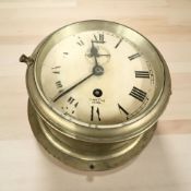 A Smith Astral brass cased ship's timepiece, diameter 20 cm.