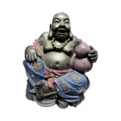 A resin figure of Buddha, height 17 cm.
