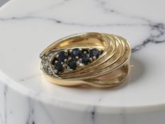 A 9ct yellow gold brooch set with diamonds and sapphires, length 25 mm.
