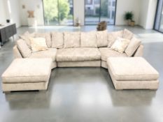 A contemporary five section modular lounge settee, with scatter cushions raised on chrome feet,