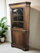 A Georgian style mahogany corner cabinet, height 192 cm.
