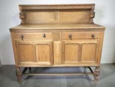An early 20th century carved oak dining room sideboard, 137 cm x 51 cm x 126 cm.