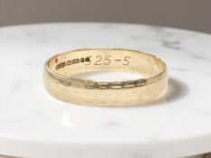 A 9ct yellow gold band ring, size P CONDITION REPORT: 2.8g.