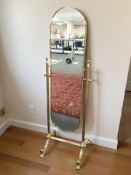 A reproduction cast brass cheval mirror, height 145 cm.