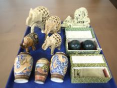A group of soapstone carvings, Chinese soapstone seal, medicine balls, three oriental vases.