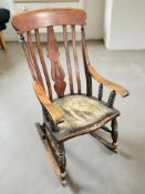 A 19th century stained beech rocking chair.