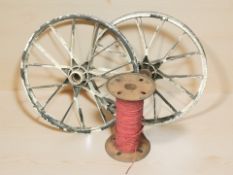 Two metal cart wheels,
