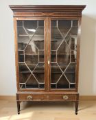 A late Victorian mahogany and satinwood banded double door astral glazed bookcase,