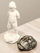 A composition statue of a boy, height 54 cm, and a further ceramic tortoise ornament.