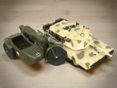 An Action Man tank and a motorcycle with sidecar.