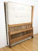 An oak 5 ft bed frame, with mattress.
