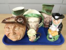 A group of Beswick Ware character jugs, Royal Doulton character jugs and a toby jug.