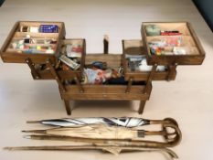 A concertina sewing box (a/f) together with a group of vintage umbrellas.