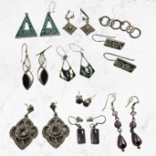 Ten pairs of silver/white metal earrings including amethyst,
