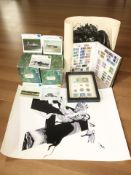 An album of British mint and cancelled stamps, 1891 coin banknote and stamp montage in frame,