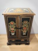 An Indian painted wooden double door table cabinet, height 47 cm.