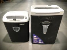 A Staples heavy duty shredder and a Fellowes shredder.