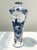 A large Delft ware blue and white vase,