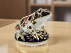 A Royal Crown Derby frog paperweight, with gold stopper.