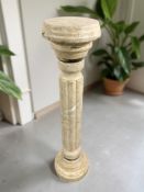 A marble classical style torchere, height 118 cm.