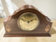 An Edwardian mahogany and satinwood inlaid eight day mantel clock, width 24 cm.