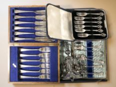 Three cases of EPNS cutlery and a silver plated epergne stand in the form of three elephants.