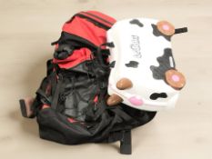 A Trunki box in the form of a cow and a ruck sack