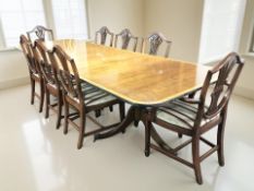 A good quality reproduction mahogany twin pedestal extending dining table in the Regency style,
