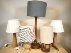 Five various contemporary wooden table lamps.