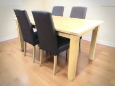 A contemporary pine effect rectangular dining table, 152 cm x 90 cm x 78 cm,