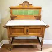 An Art Nouveau satin walnut marble topped wash stand, 108 cm x 47 cm x 121 cm.