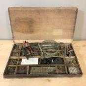 A wooden box of Meccano