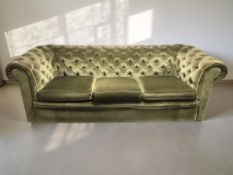 A Chesterfield style three seater club settee in deep buttoned green dralon, 225 cm x 92 cm x 73 cm.