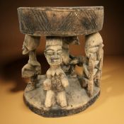 An African carved hardwood figural stool, height 37 cm.