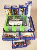 Twelve various die cast scale model vehicles, ships and aircraft including Siku, in boxes.