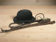 Three leather riding crops,