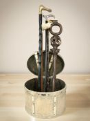 An oval lidded box and five various walking sticks