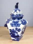 A transfer printed blue and white lidded temple jar decorated with oriental scenes, height 44 cm.