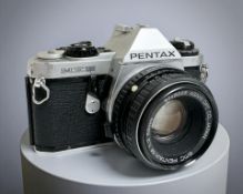 A Pentax ME Super 35mm film camera, with SMC Pentax-M 1:2 50mm lens.