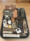 A group of harmonicas including Hohner, a Holiday II 8mm film camera, bakelite fishing reel,