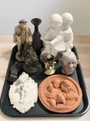 A group of ceramic plaques, figures, sculptures, etc.
