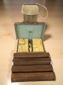 A Mah-jong set in leather travel case and four wooden tile boards in canvas carry bag