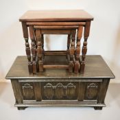 An oak linen fold blanket chest and a nest of three tables.