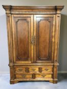 A Barker & Stonehouse stained pine double door wardrobe fitted five drawers beneath,