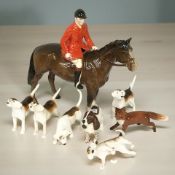A Beswick huntsman on horseback, brown gloss (horse's ear restored),