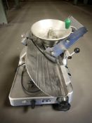 A Berkel stainless steel commercial slicer, together with a sieve/grinder.